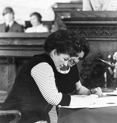 Betty Babcock signing the Montana Constitution